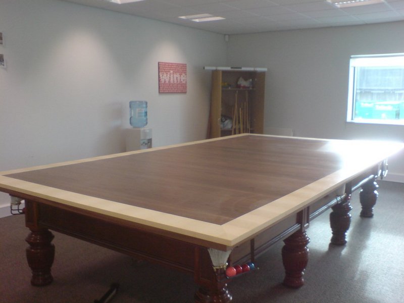 Games table covers are just one of the many uses of real wood veneers in a living room.