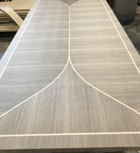 Walnut dining table with veneer inlays